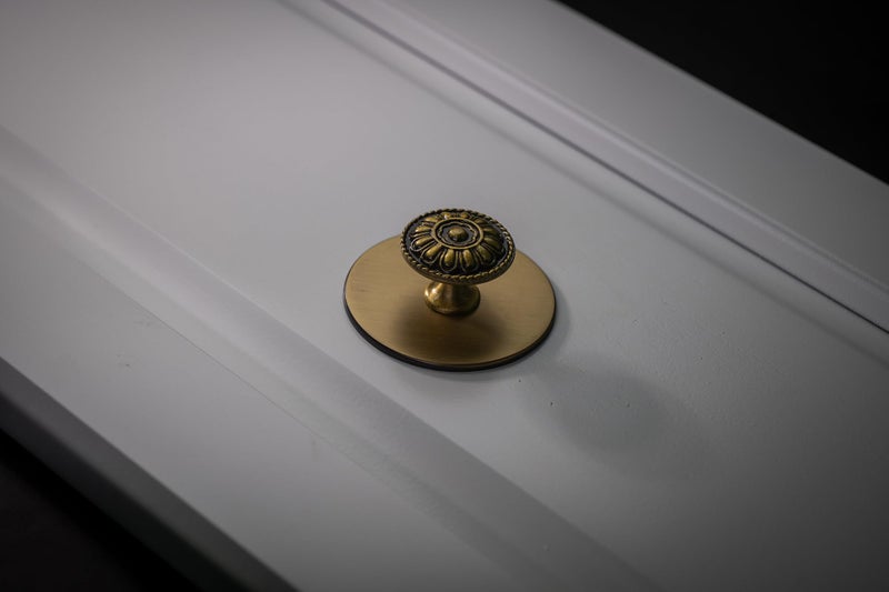 trust4care 9 Pack Euro-Style Brushed Antique Brass Kitchen Cabinet Knobs, Zinc Alloy Vintage Drawer Knobs, Aged Gold Round Dresser Handles with Floral for Bathroom & Furniture, 1.25" Diameter - Image 4